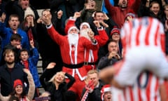 Stoke City v Manchester United - Barclays Premier League - Britannia Stadium<br>Stoke City’s Marko Arnautovic celebrates scoring his side’s second goal of the game in front of two fans dressed as Santa Claus during the Barclays Premier League match at the Britannia Stadium, Stoke. PRESS ASSOCIATION Photo. Picture date: Saturday December 26, 2015. See PA story SOCCER Stoke. Photo credit should read: Mike Egerton/PA Wire. RESTRICTIONS: EDITORIAL USE ONLY No use with unauthorised audio, video, data, fixture lists, club/league logos or “live” services. Online in-match use limited to 75 images, no video emulation. No use in betting, games or single club/league/player publications.