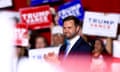 JD Vance in a blue suit at a campaign rally.