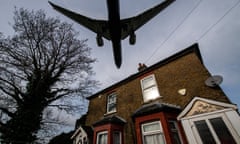 Aircraft come in to land at Heathrow airport over nearby houses
