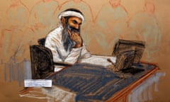 In this photo of a sketch by courtroom artist Janet Hamlin and reviewed by the US Department of Defense, Khalid Sheikh Mohammed reads a document during his military hearing at Guantánamo Bay on 5 May 2012.