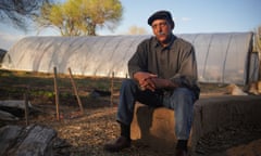 Richard Moore, the cofounder of the Los Jardines Institute, sits nearby the institute’s hoop house and newly planted crops in early April. Moore sees the potential in a place like Valle de Oro not just because it provides much needed green space, but because it’s a buffer from more industry.