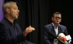 Victorian premier Daniel Andrews looks on as chief health officer Brett Sutton provides a coronavirus update on Friday