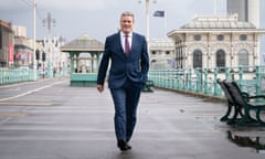 Labour leader Sir Keir Starmer walks along Brighton seafront.