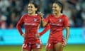 Kansas City Current midfielder Lo'Eau LaBonta (10) and midfielder Debinha (99) look on during a 2023 game against the Chicago Red Stars at Children's Mercy Park. 