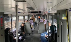 Passengers on an Elizabeth line train at standstill.