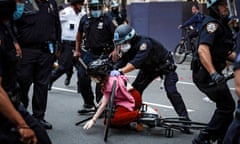 A protester is grabbed by a police officer in Manhattan in June 2020. 