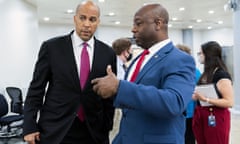 Cory Booker and Tim Scott talk in Washington in July.