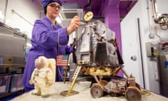 A chocolatier adds the finishing touches to a chocolate recreation of the Apollo 11 moon landing at Cadbury World