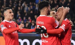 João Mário (right) celebrates with Benfica teammates after scoring a penalty in the second half against Club Brugge.