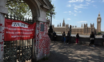 The national Covid memorial wall, facing the Houses of Parliament, across the river Thames.