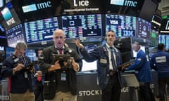 Traders and financial professionals work ahead of the closing bell on the floor of the New York Stock Exchange