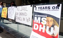 Signs put up by supporters of Ms Dhu
