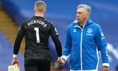 Everton manager Carlo Ancelotti shakes hands with Jordan Pickford after a match against Crystal Palace.