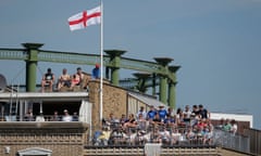 Fans watching from overlooking flats during day three of the fifth Ashes Test match between England and Australia at the Kia Oval