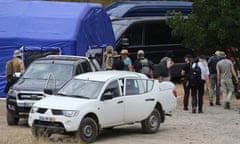 FILE - Police search teams arrive back to an operation tent near Barragem do Arade, Portugal, Tuesday May 23, 2023. German prosecutors say they will examine objects that were found in a search in Portugal last week for clues regarding the disappearance of Madeleine McCann, but can’t yet say whether they are linked to the British girl who went missing in 2007. (AP Photo/Joao Matos, File)