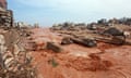 People look at damage in Derna