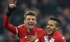 Thomas Müller celebrates with Thiago Alcântara after scoring Bayern Munich’s third goal in the 5-0 win against Wolfsburg.