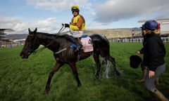 Paul Townend rides Galopin Des Champs as the horse is doused with water after victory in the Gold Cup.