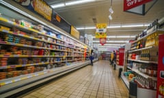 A shopper peruses the aisles in a local supermarket