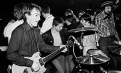 Andy Gill with guitar and fans