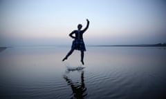 A Scottish dancer with one arm aloft on Islay