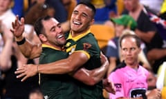 Valentine Holmes, right, is congratulated by Cameron Smith after scoring one of his six tries.