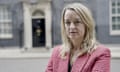 Laura Kuenssberg in a pink jacket standing outside 10 downing street