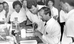  Dennis Bidwell, seated, with Alister Voller, standing, in China in 1978 demonstrating the Elisa microplate