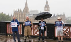 Remain campaigners hold placards in front of the Houses of Parliament, where MPs returned on Monday to pay tribute to MP Jo Cox.