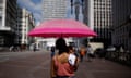 A woman holding her two-month-old son as they sheltered from the sun in the centre of São Paulo in late September.