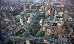 An aerial view shows the skyline of central Shanghai, along the Huang Pu river<br>An aerial view, released April 14, 2010, shows the skyline of central Shanghai, along the Huang Pu river March 28, 2010. Picture taken March 28, 2010. REUTERS/Shanghai Pacific Institute for International Strategy/Handout (CHINA - Tags: BUSINESS TRAVEL) FOR EDITORIAL USE ONLY. NOT FOR SALE FOR MARKETING OR ADVERTISING CAMPAIGNS :rel:d:bm:GF2E64F0LQA01