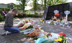 A memorial to the victims at Highland Park. Prosecutors have said Crimo, 21, admitted to the shooting when police arrested him.