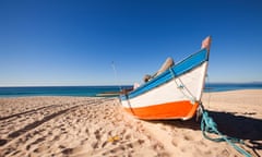 Fisherman’s boat on the beach, at Troia, Portugal.