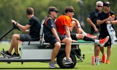 Cincinnati Bengals quarterback Joe Burrow is carted off the field after an injury at training camp on Thursday.