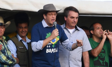 Brazil’s environment minister Ricardo Salles, who has quit, delivers a speech flanked by president Jair Bolsonaro.