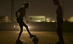 Unstoppable … frequent power cuts mean the women have to train using car headlights, as captured here in Freedom Fields.