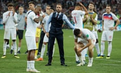 England head coach Gareth Southgate consoles Harry Maguire and the rest of his team after the World Cup semi-final against Croatia.