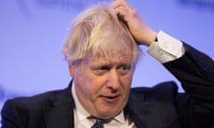 Boris Johnson gestures during the Global Soft Power Summit at the QEII centre in London