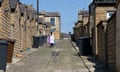 Back alleyway of terraced housing, Nelson, Burnley, Lancashire, England.