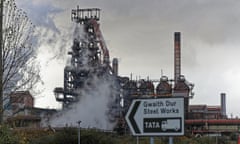 General view of the Tata Steelworks in Port Talbot, with a road sign in the foreground