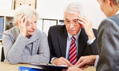 Anxious elderly senior couple worring about financial security at consultation