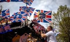 A kiosk vendor adjusts coronation souvenirs in London on 4 May 2023.