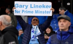 A Manchester City fan with a sign in support of BBC presenter Gary Lineker before the match.