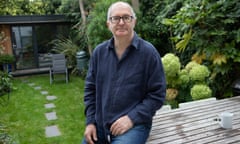 Author John Lanchester at home in front of hs garden retreat where he writes. London, 23/9/20