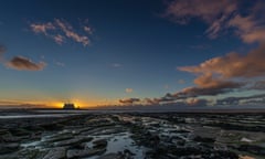 The sun sets at Hinkley Point nuclear power station