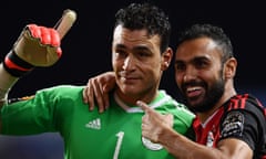 Egypt’s goalkeeper Essam El Hadary (left)  and midfielder Ahmed Elmohamady celebrate beating Burkina Faso on penalties to reach the final of the Africa Cup of Nations