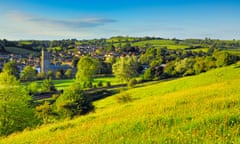 A field of ‘greenery-yallery’ grass in May, over the historic town of Bruton, Somerset.
