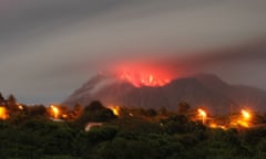 Ash and lava are visible inside the cone of the Soufrière Hills volcano, seen from Olveston, Montserrat, in January 2007