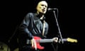 Wilko Johnson playing guitar on stage