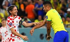 Luka Modric of Croatia and Brazil’s Casemiro share a moment in the World Cup quarter-final